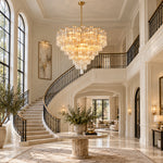 Round tiered glass chandelier in a double-height foyer