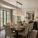 Scalloped Marble Linear Pendant installed above a dining table
