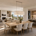 Scalloped Marble Linear Pendant installed above a dining table