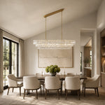 Linear clear glass chandelier room scene.