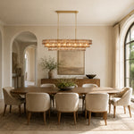 Linear amber glass chandelier room scene.