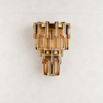 Amber crystal wall sconce with Brass-finish hardware, shown as a complete fixture