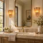 Amber crystal wall sconce shown in a furnished interior