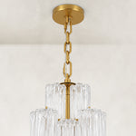 Ceiling canopy and suspension-chain detail of the tall glass chandelier