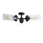 Black three-arm glass cylinder flush mount against a white background.