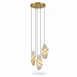 Three illuminated alabaster slabs with gold-colored bands suspended from a round canopy