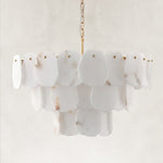 Unlit three-tier scalloped alabaster chandelier with brass-finish fittings