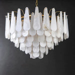 Unlit tiered alabaster panel chandelier against a neutral background.