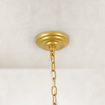 Compact crystal drum chandelier, gold-tone canopy and chain close view.