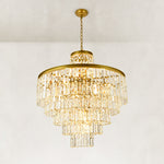 Illuminated tiered crystal drum chandelier, full angled product view.