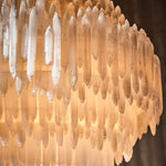 Close-up of light glowing through overlapping selenite pieces.
