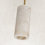Unlit cylindrical stone pendant with a gold-colored rod.