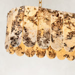 Product detail of Variegated Scalloped Marble Island Pendant against a neutral background