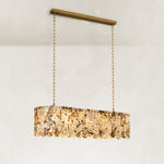 Product detail of Variegated Scalloped Marble Island Pendant against a neutral background