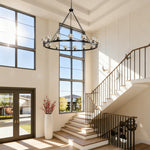 Black glass cup ring chandelier in stairwell