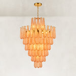 Tiered amber chandelier with a raised upper crown and gold-tone chain suspension.