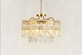Close view of an illuminated faceted crystal drum chandelier and layered crystal detail