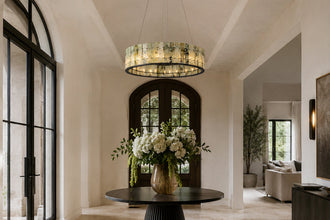 Green marble ring chandelier suspended beneath a vaulted entryway ceiling
