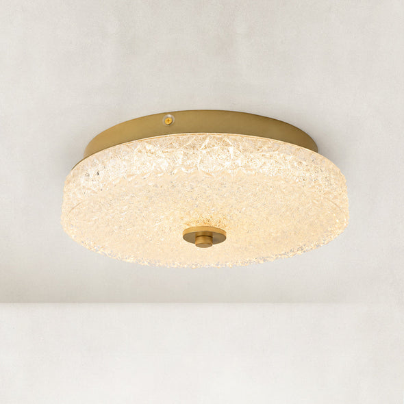 Illuminated low-profile textured glass flush mount viewed from below