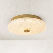 Illuminated low-profile textured glass flush mount viewed from below