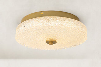 Illuminated low-profile textured glass flush mount viewed from below