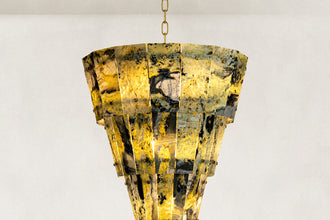 Tapered marble panel chandelier shown against a neutral background for fixture specification review