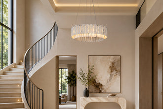 Two-tier white marble ring chandelier installed near an indoor staircase