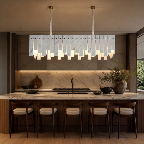 Linear pendant lighting above a refined kitchen island