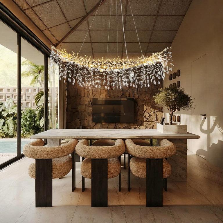 Brass-finish crystal branch linear chandelier in a furnished room