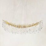 Brass-finish crystal branch linear chandelier with the complete fixture visible