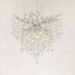 Silver-finish deep crystal branch cascade chandelier with the complete fixture visible