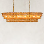 Amber fluted glass linear chandelier with stepped tiers