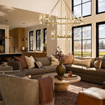 Brass-finish two-ring clear glass tube chandelier in a furnished room