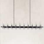 Black-finish clear glass tube linear chandelier with the complete fixture visible