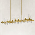 Brass-finish clear glass tube linear chandelier with the complete fixture visible