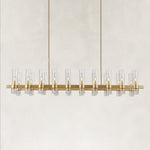 Brass-finish clear glass tube linear chandelier with the complete fixture visible