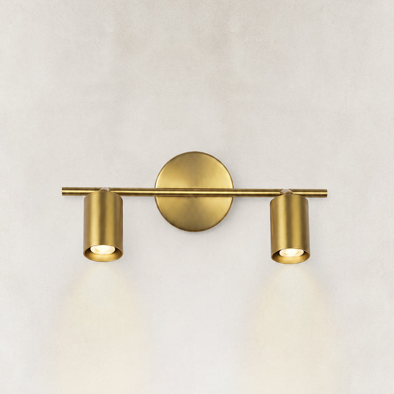 Brass adjustable twin-cylinder picture light shown as a complete fixture
