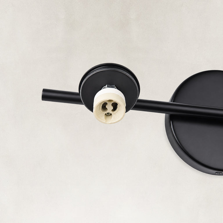 Round wall mounting detail on the matte-black picture light