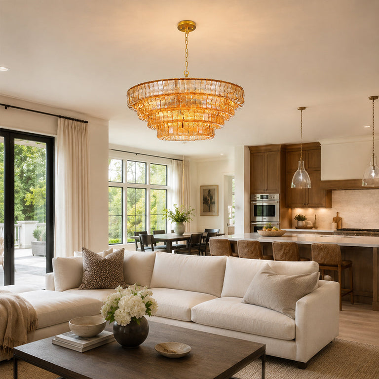 Amber round chandelier in an open-plan kitchen living room.