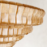 Amber ribbed-glass tiers on a round chandelier.