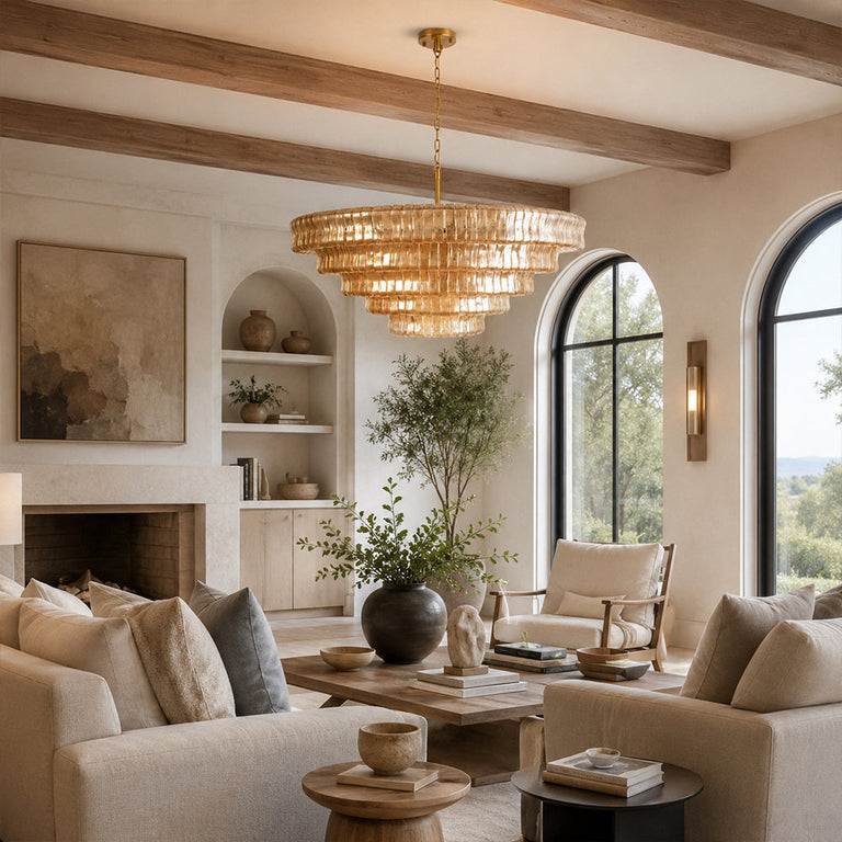Amber tiered-glass chandelier in an arched-window living room.