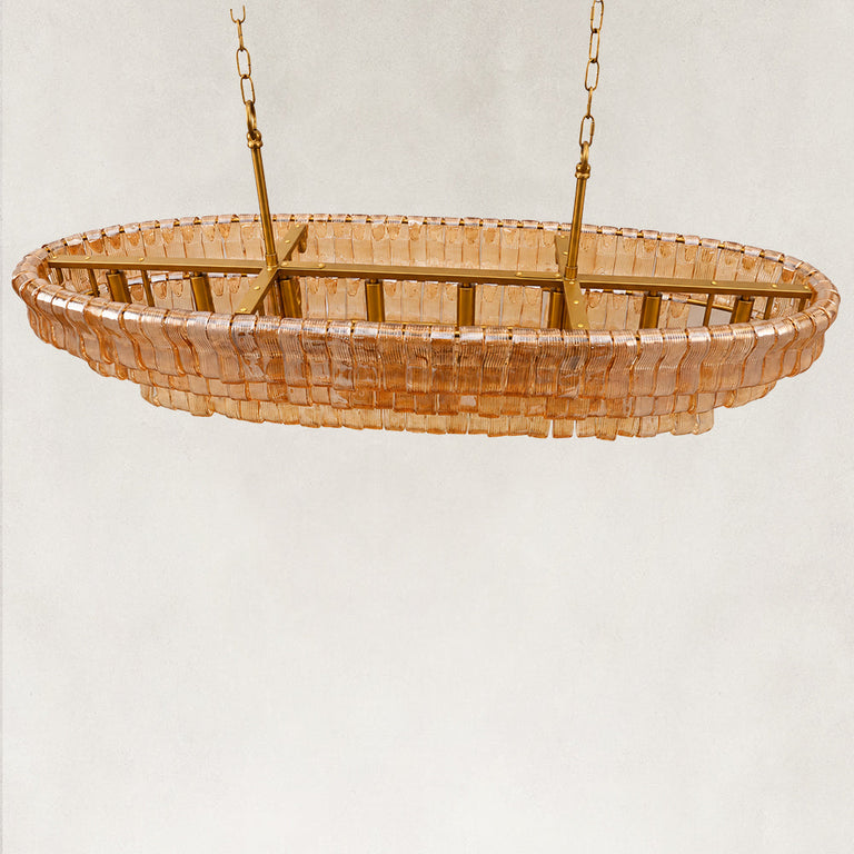 Amber glass linear chandelier viewed from above.