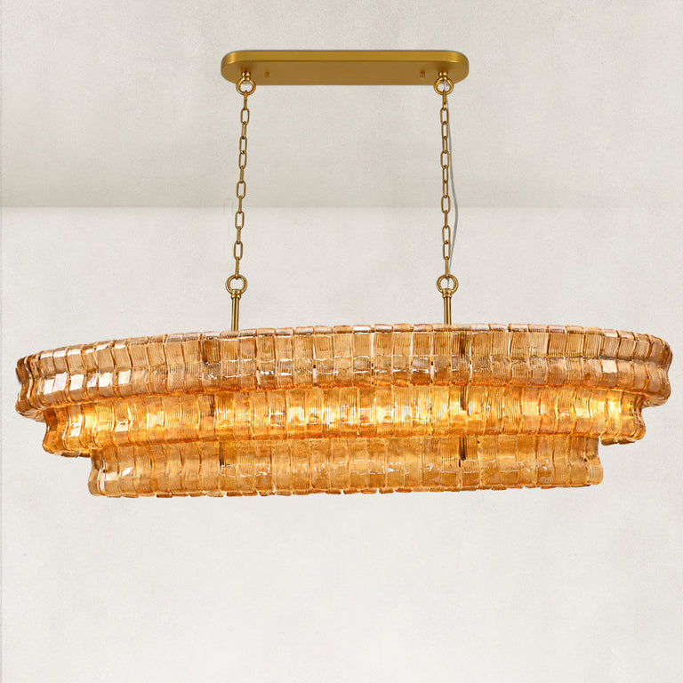 Amber glass linear chandelier with its canopy and chains.
