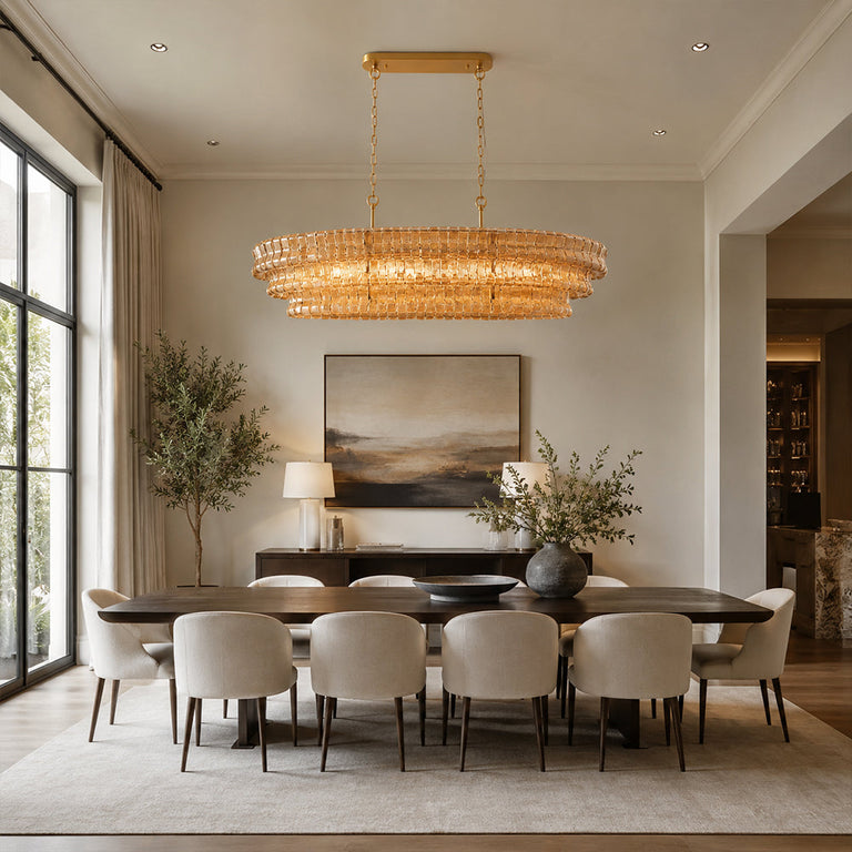 Amber glass rectangular chandelier above a dark dining table.