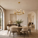 Antler ring above dining table beside arch
