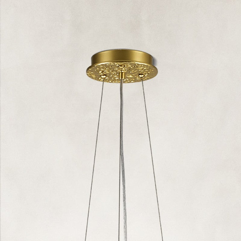 brass-tone crystal-branch chandelier ceiling canopy detail.