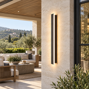 Averon wall sconce beside an outdoor seating area