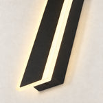 Black linear sconce illuminated edge detail