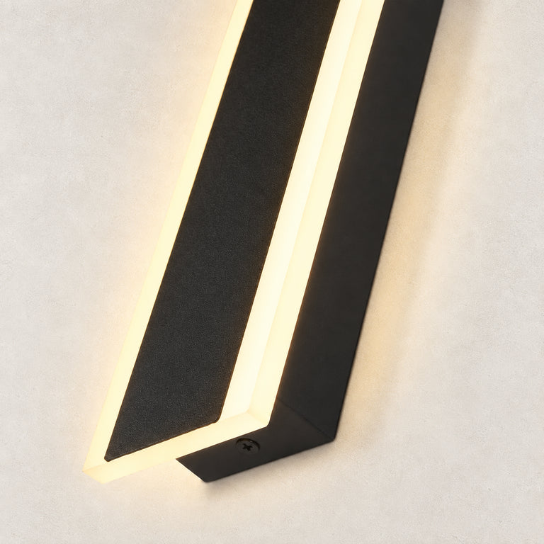 Black linear sconce illuminated edge detail