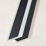 Black linear sconce unlit edge detail